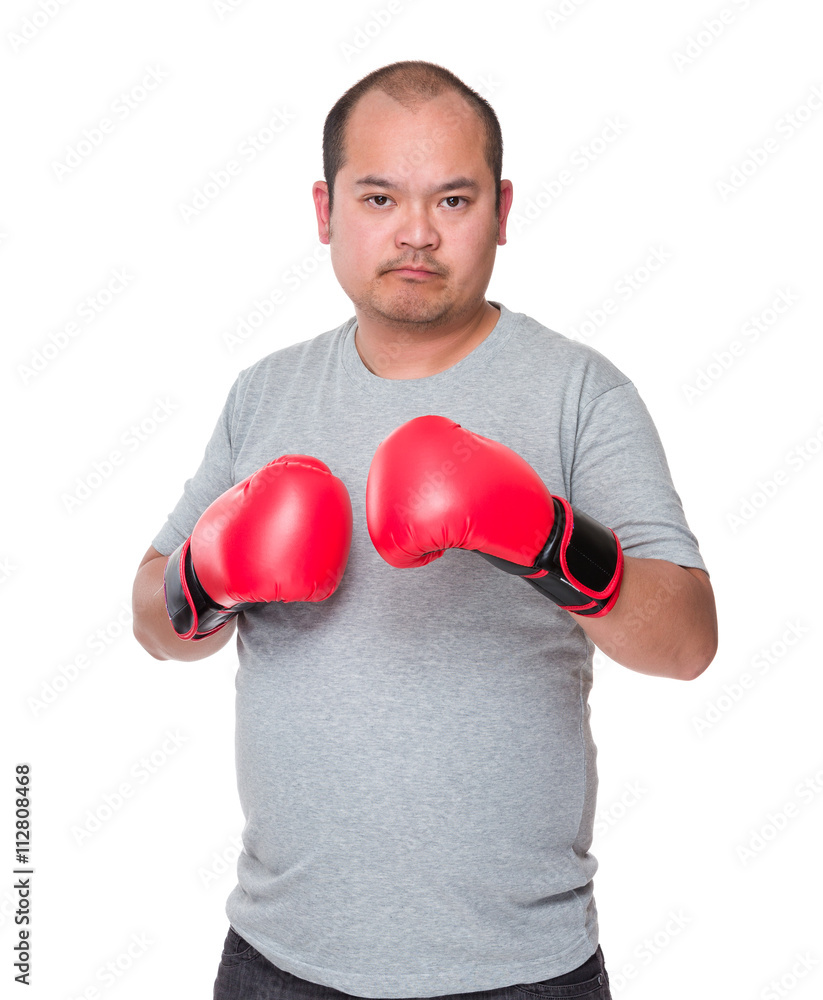 Asian man wearing boxing gloves