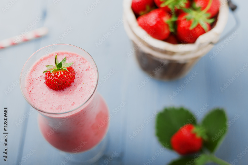 Delicious strawberry smoothie with milk, prepared with fresh str Delicious strawberry smoothie with milk, prepared with fresh str
