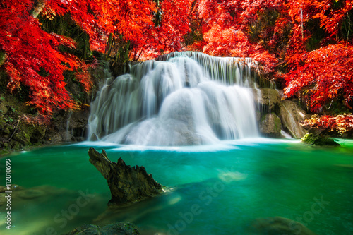 Waterfall in beautiful autumn forest 