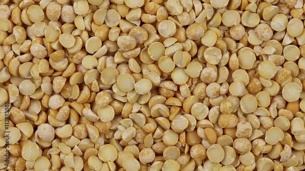 Yellow peas close up. Loop rotation. Front of the camera rotates plate with yellow peas Yellow peas close up. Loop rotation. Front of the camera rotates plate with yellow peas
