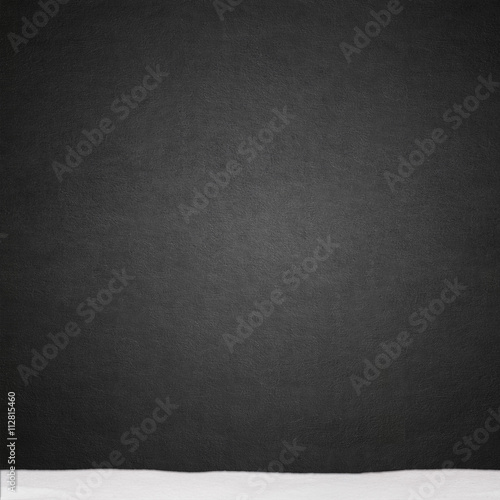 black stucco wall and snow texture background