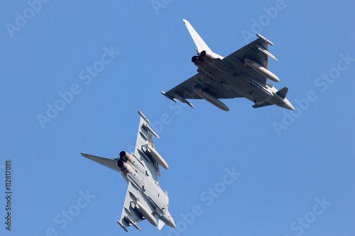 Two fighter jets breaking to land photo