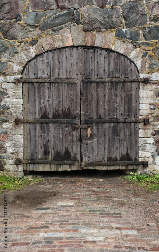 Old medieval door and stone wall texture Old medieval door and stone wall texture