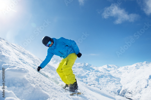 Active man in snowy mountains