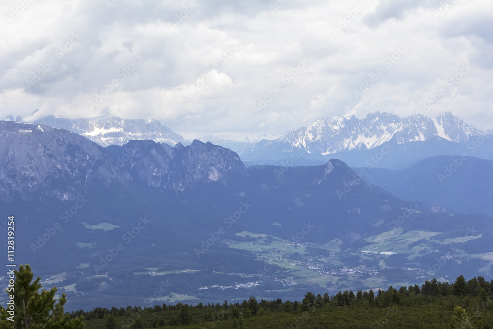 background landscape view of the snowy peaks of the Alps from the observation deck of Bolzano, Tyrol, Trentino, Italy