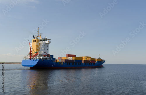  Cargo ship sailing in still water