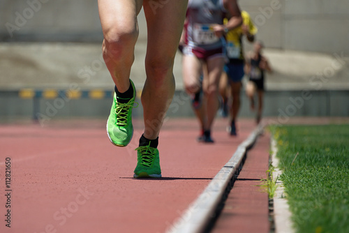 Fototapeta Naklejka Na Ścianę i Meble -  Athletics people running on the track field