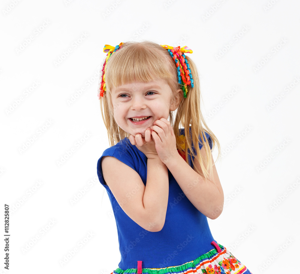 Portrait of pleased little blond girl with two tails on white Portrait of pleased little blond girl with two tails on white