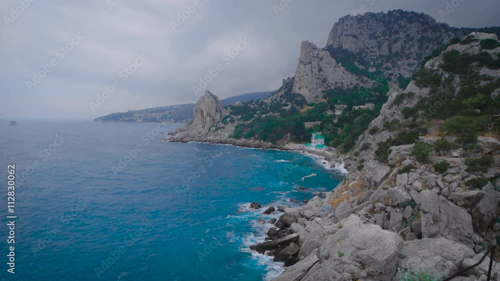 Catholic and Protestant church on the beach, at the foot of the mountain. Catholic and Protestant church on the beach, at the foot of the mountain.