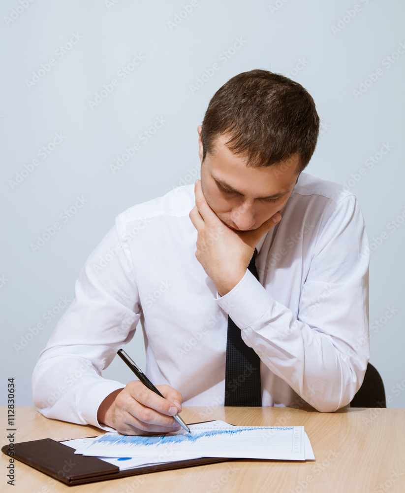 Businessman examining documents Businessman examining documents