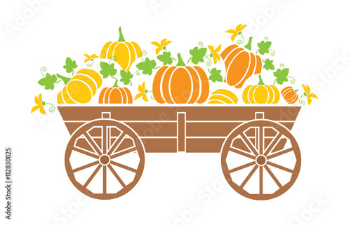 Old wagon with a pumpkin with a flowers.