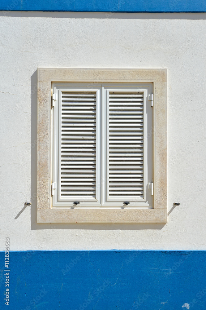 Exterior of wall house with window shutters, Portugal Exterior of wall house with window shutters, Portugal