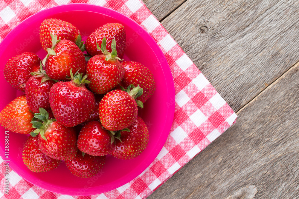 Strawberries on red and white checkered napkin Strawberries on red and white checkered napkin