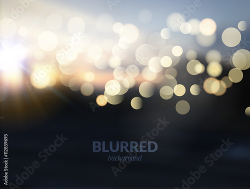 Blurred nature landscape with bokeh lights effect