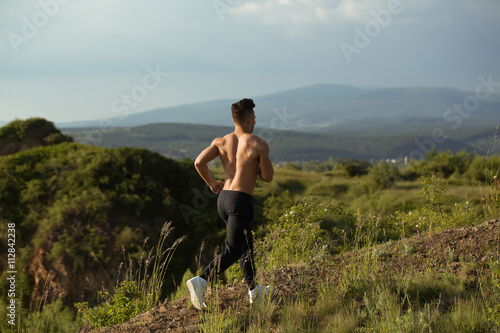 Sexy muscular man running outdoor