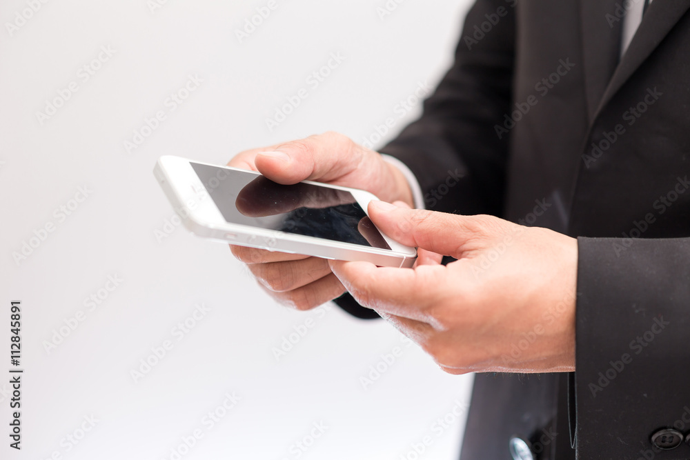 Business man show cell telephone in black dressed suit on white Business man show cell telephone in black dressed suit on white