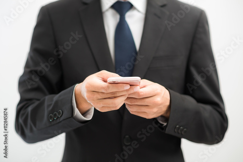 Handsome business asian man using smart phone