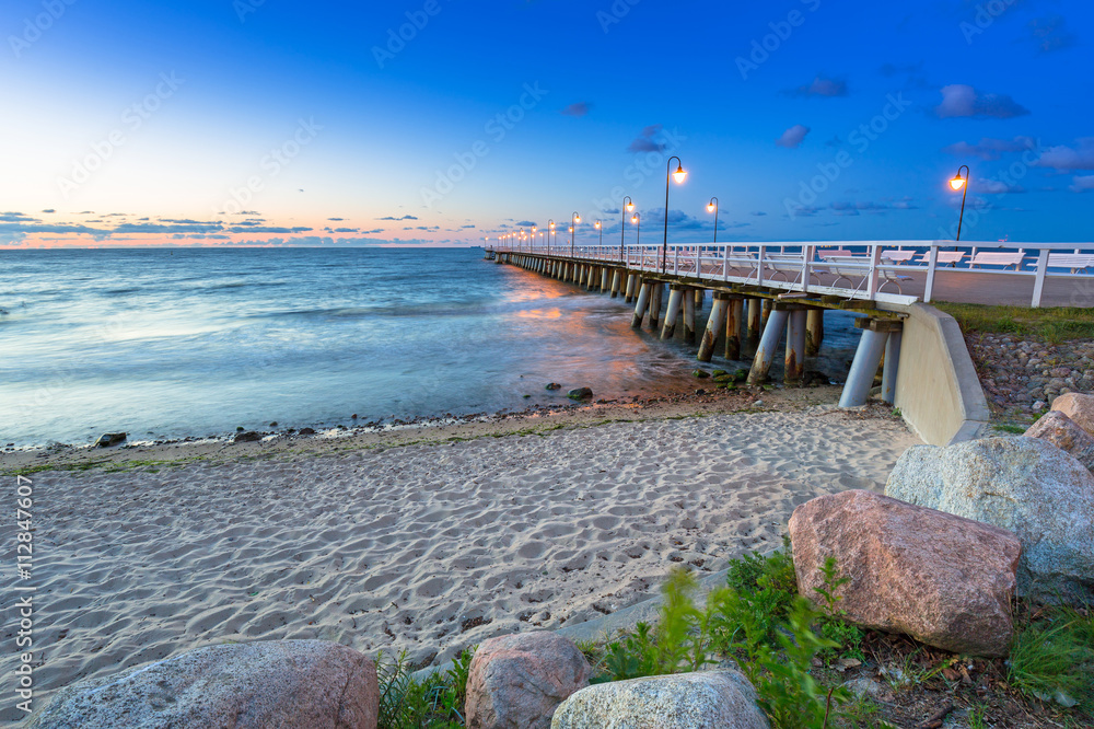 Fototapeta premium Baltic sea with pier in Gdynia Orlowo at sunrise, Poland