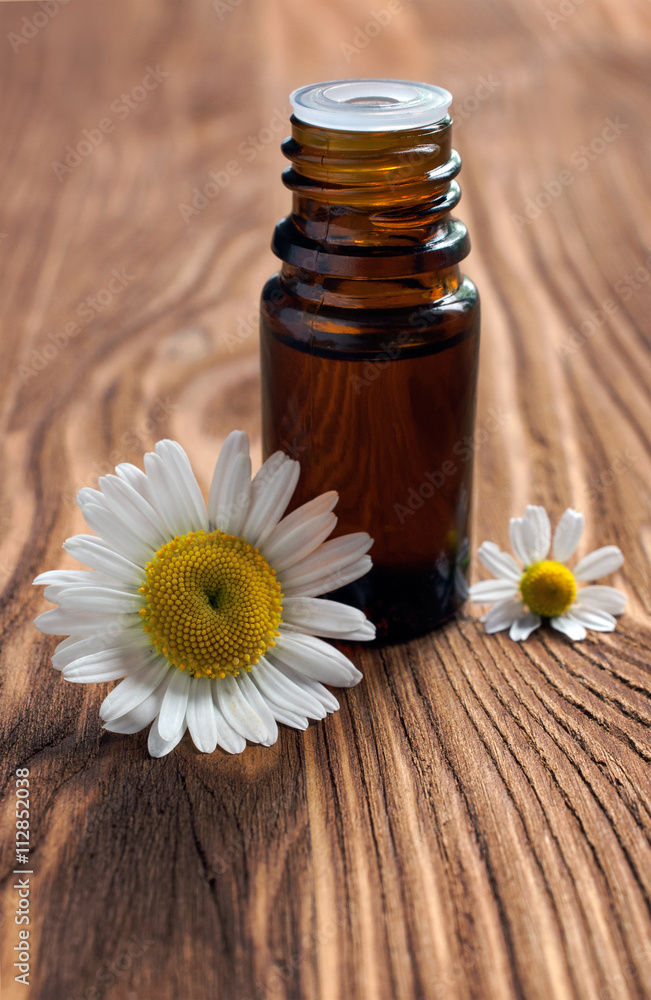 Small bottle with essential oil of chamomile
