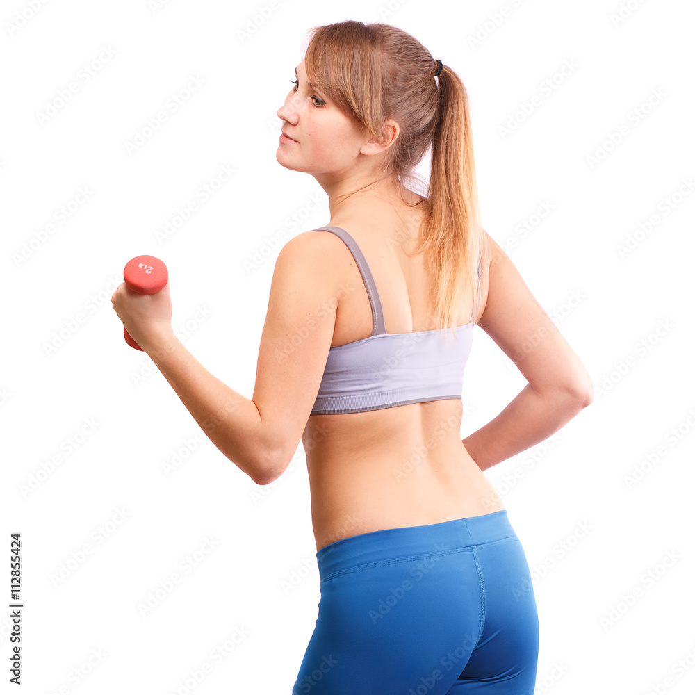 The girl goes in for sports in the studio on a background. The girl goes in for sports in the studio on a background.