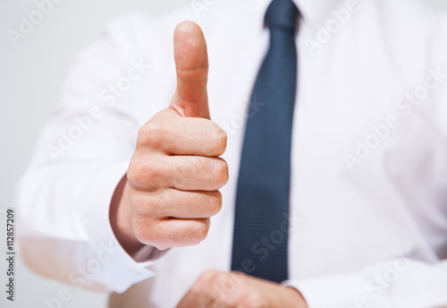 Businessman showing a thumb up sign