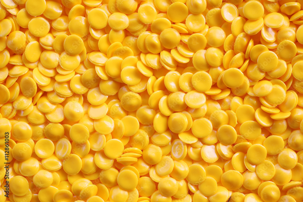 yellow industrial plastic pellets background yellow industrial plastic pellets background