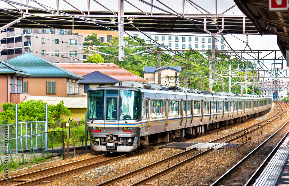Rapid train is passing Maiko station, Japan Rapid train is passing Maiko station, Japan