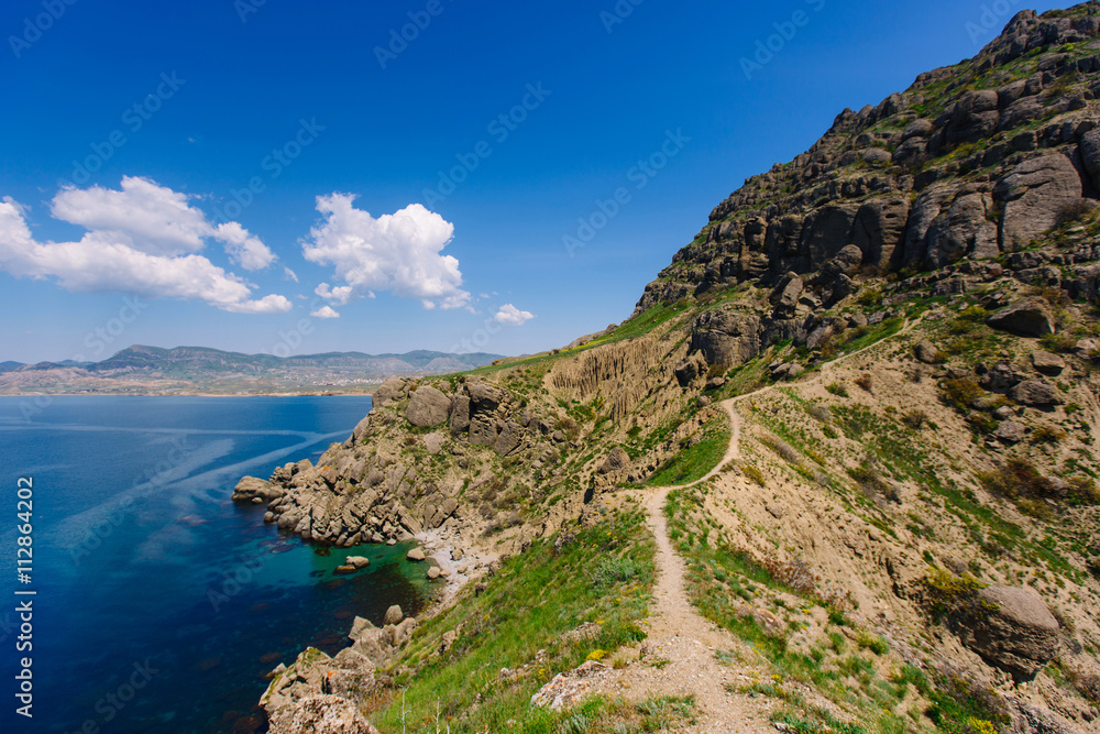 Coastal rocks, coastline, rocky shore, view from the sea, the Peninsula of the Crimea, the Black sea coast