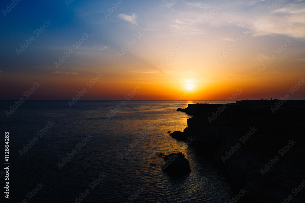 Sunset on the rocky seashore, Cape Fiolent, Crimea