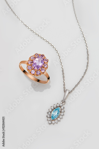 Jewelry set of gold ring and silver pendant with pink and blue t