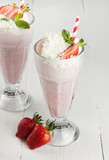 Milkshake with strawberry in glasses