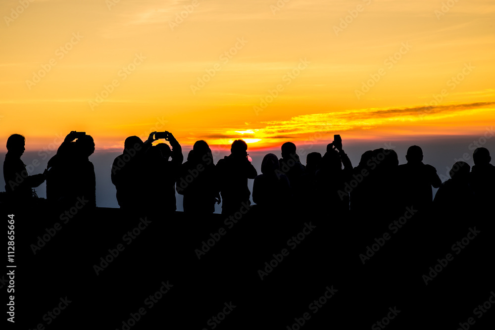 Fototapeta premium silhouette People on Mountain sunrise time in morning