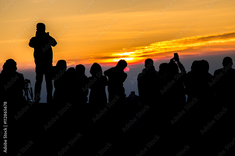 Fototapeta premium silhouette People on Mountain sunrise time in morning