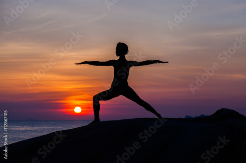 Fototapeta Naklejka Na Ścianę i Meble -  Yoga at sunset time