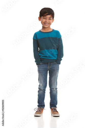 Full length portrait of a young, mixed race boy.  Isolated on white.