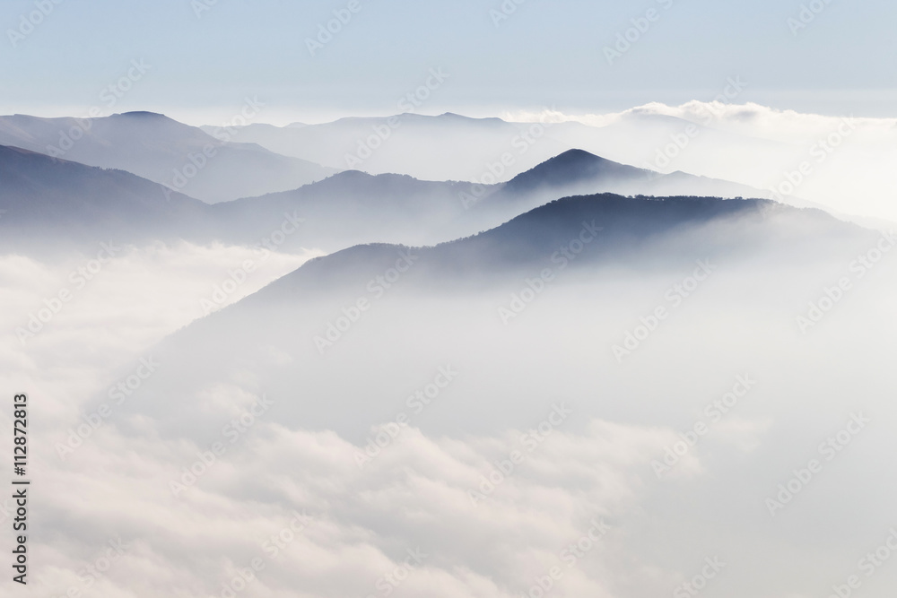 Silhouettes of mountains in the mist