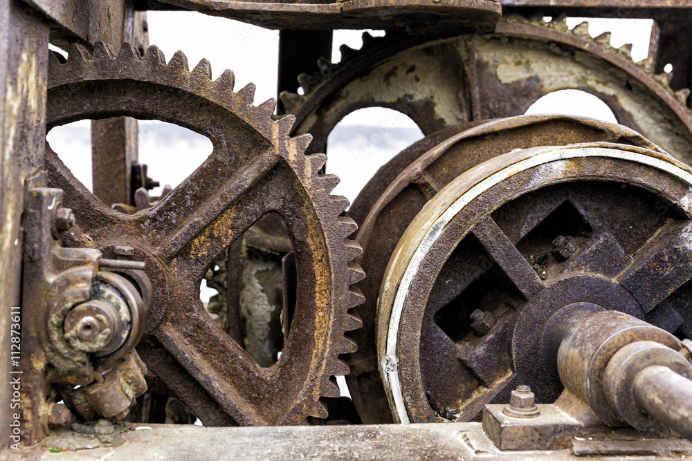 Old rusty gears for heavy industry as a machinery parts closeup