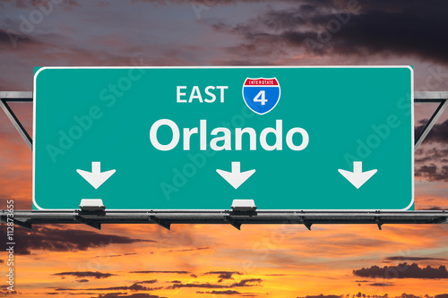 Interstate 4 East to Orlando Highway Sign with Sunrise Sky