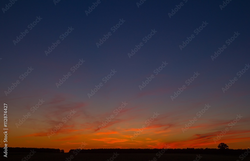 Beautiful after sunset sky over fields in Poland.