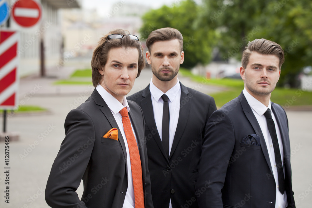 Three young men in elegant business suits Three young men in elegant business suits