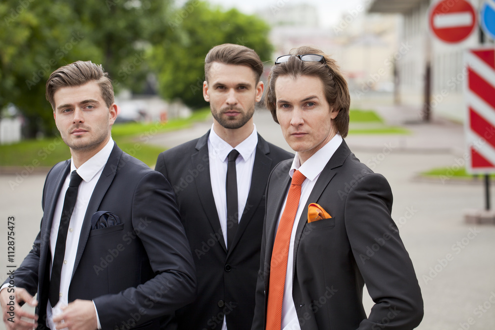 Three young men in elegant business suits Three young men in elegant business suits