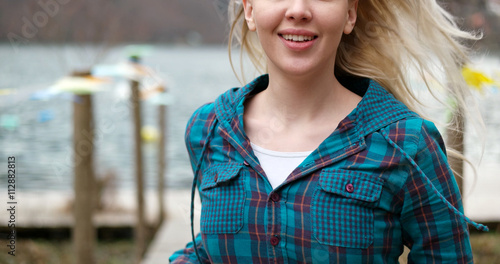 woman running on dock, close up of hair © Myvisuals