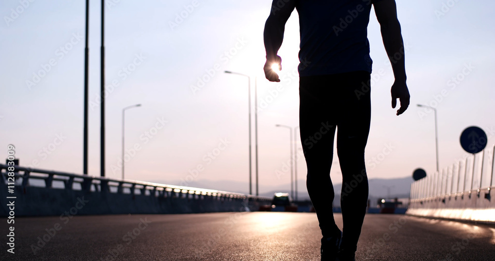 Running at sunrise man exercising for marathon and workout fitne Running at sunrise man exercising for marathon and workout fitne