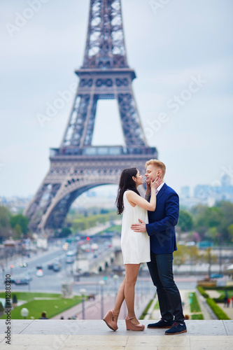 Romantic couple in Paris near the Eiffel tower