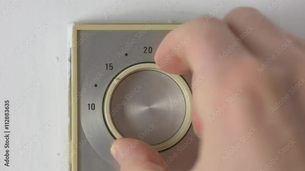 Turning down the temperature of the home heater thermostat. Turning the