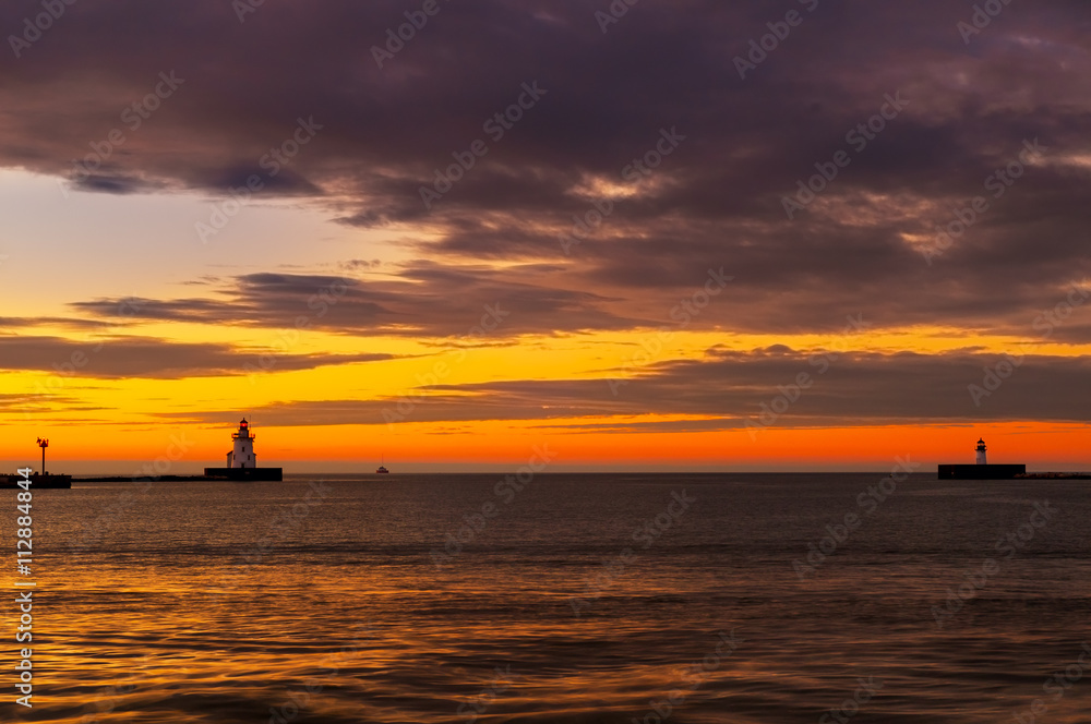 Lake Erie beacons at the mouth of Cleveland's harbor at sunset