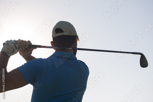 golf player hitting shot
