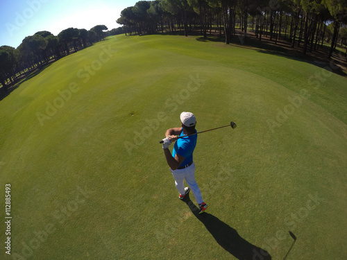 top view of golf player hitting shot photo