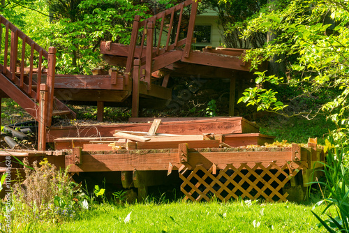Partial demolition of a dilapidated backyard deck