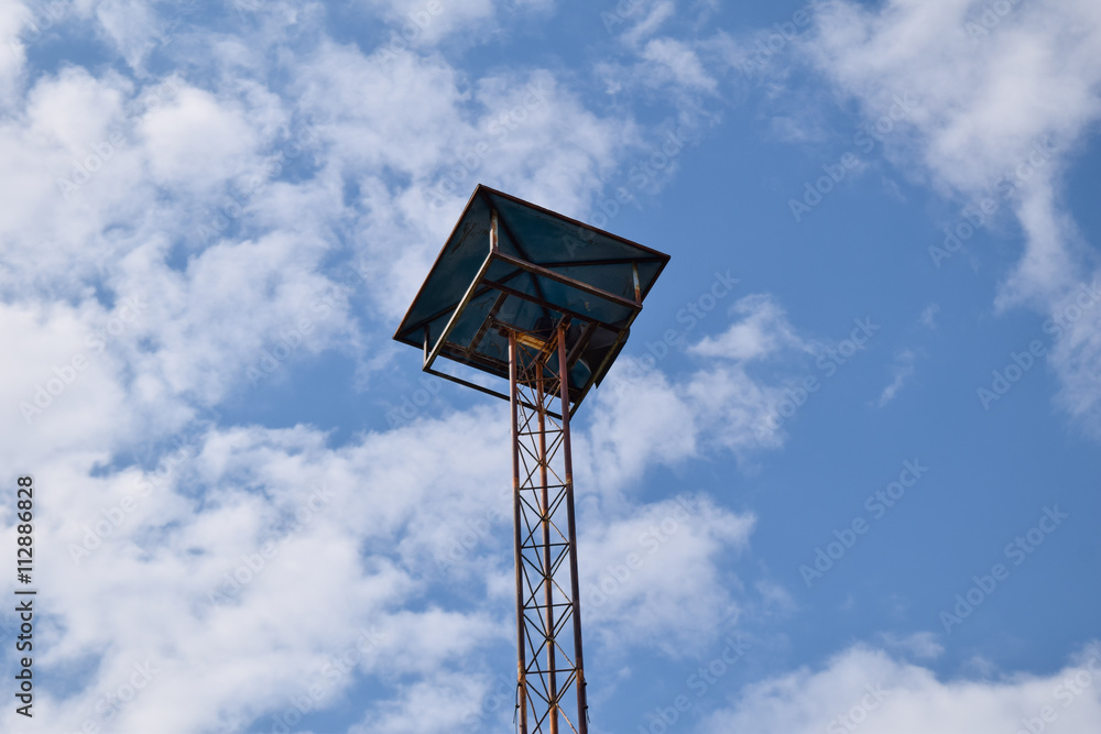 Villege broadcast tower with sky background